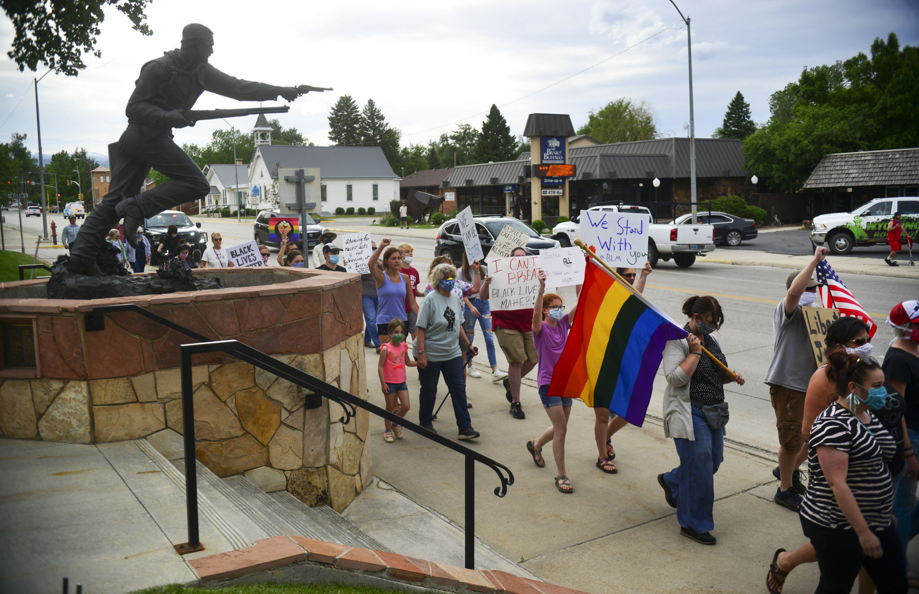 The marchers passed by the Nate Champion statue
